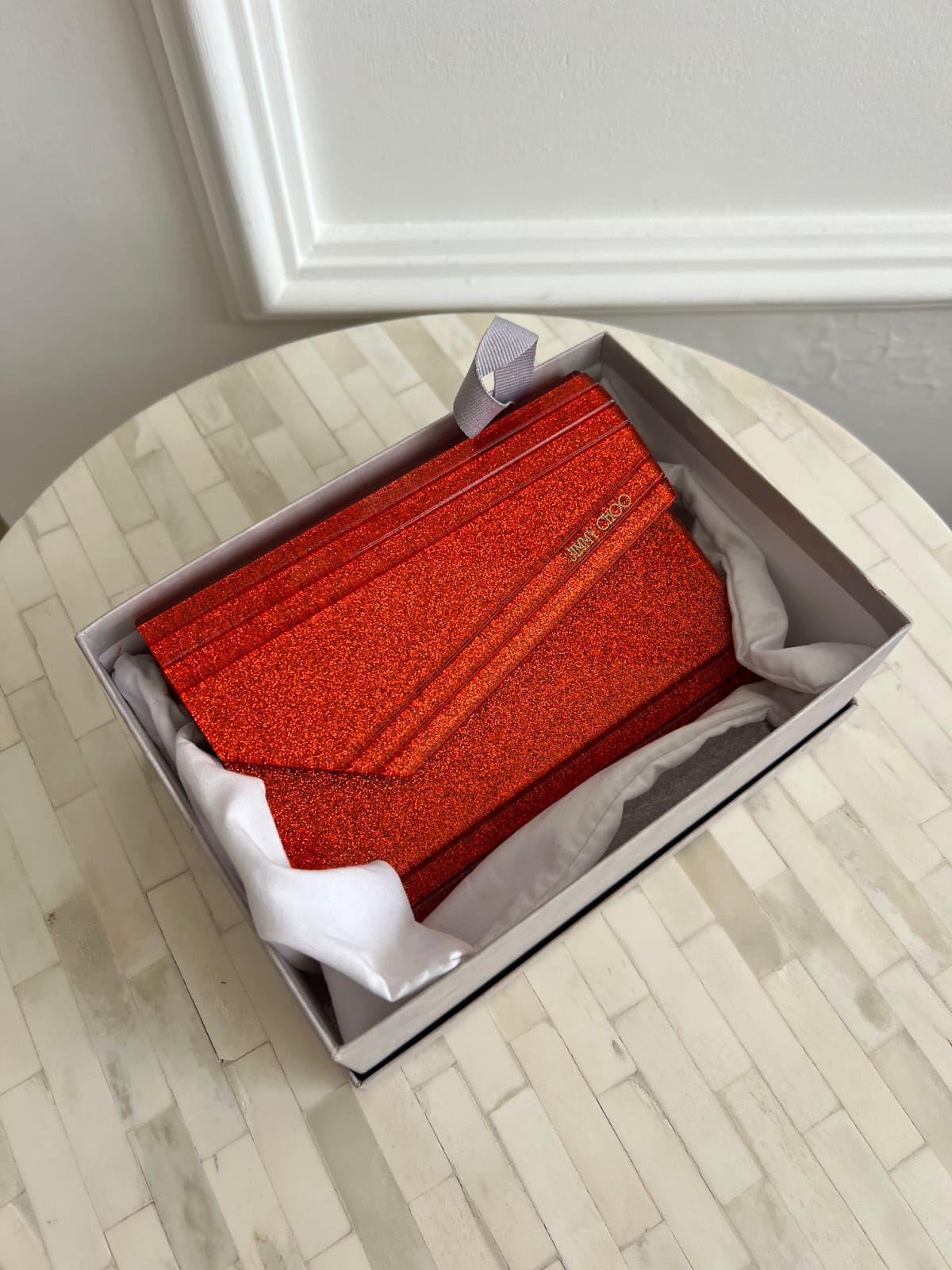 Jimmy Choo
Orange Acrylic and Leather Clutch thumbnail 2
