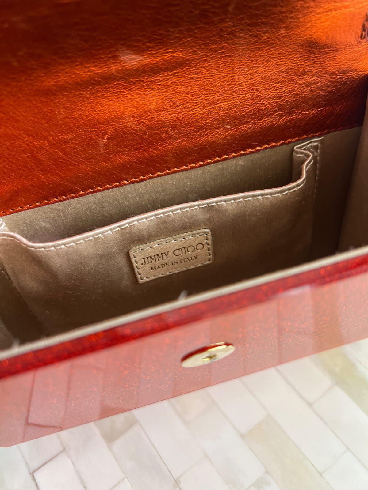 Jimmy Choo
Orange Acrylic and Leather Clutch thumbnail 3